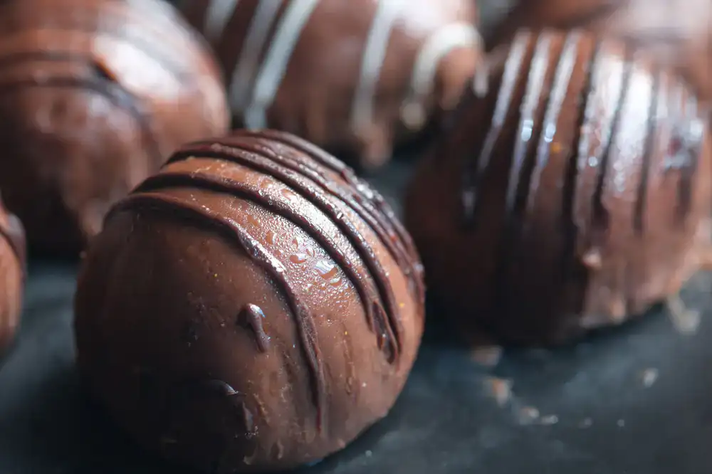 Close up of a glossy handcrafted artisan chocolate truffle
