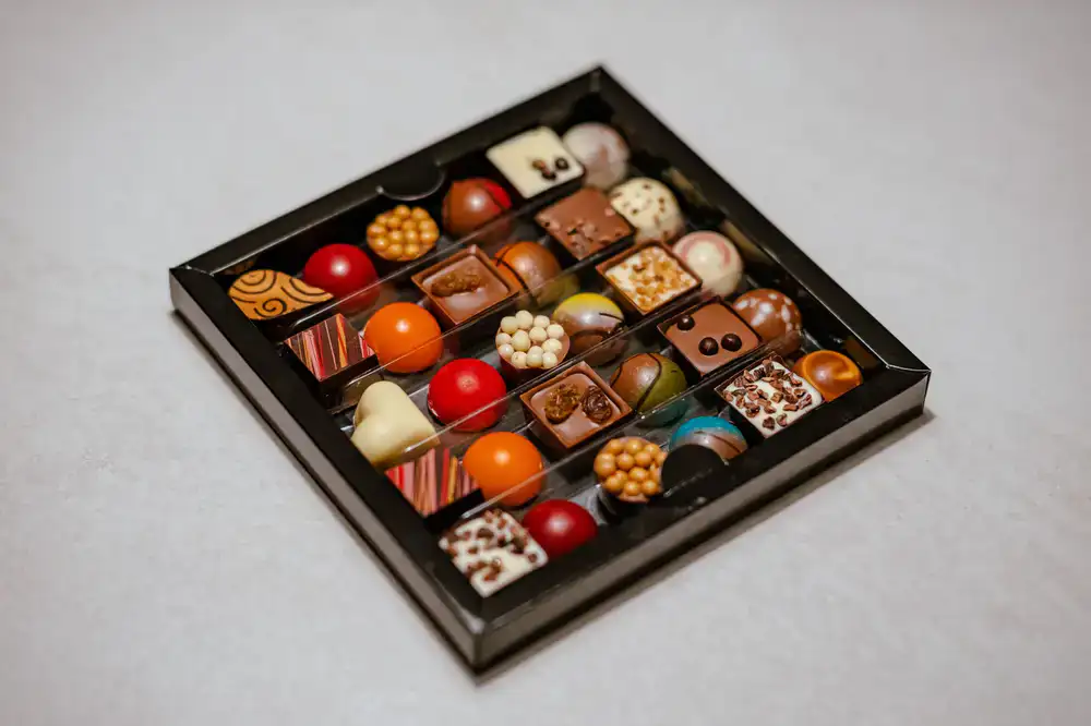 Velvet Cacao signature chocolate assortment box opened on a table